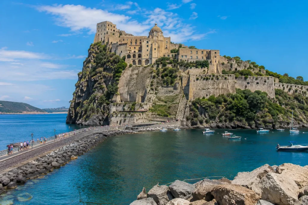 Aragonese Castle in Ischia overlooking the Mediterranean Sea, seen from a yacht