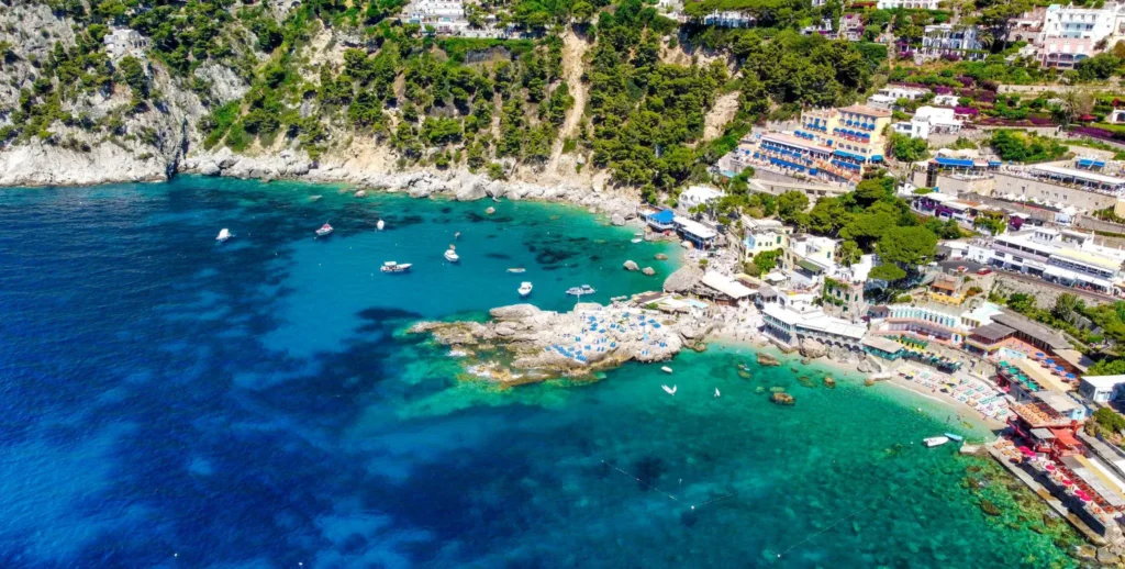 Marina Piccola in Capri with turquoise water, luxury yachts and dramatic coastal cliffs