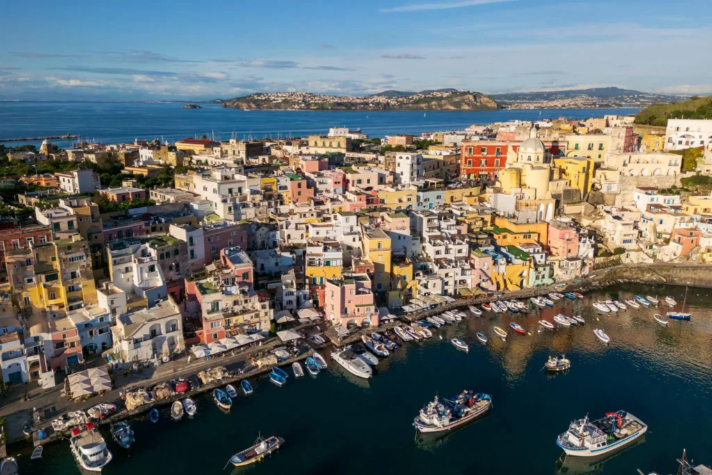 Marina Corricella in Procida with pastel-coloured houses overlooking the Mediterranean Sea