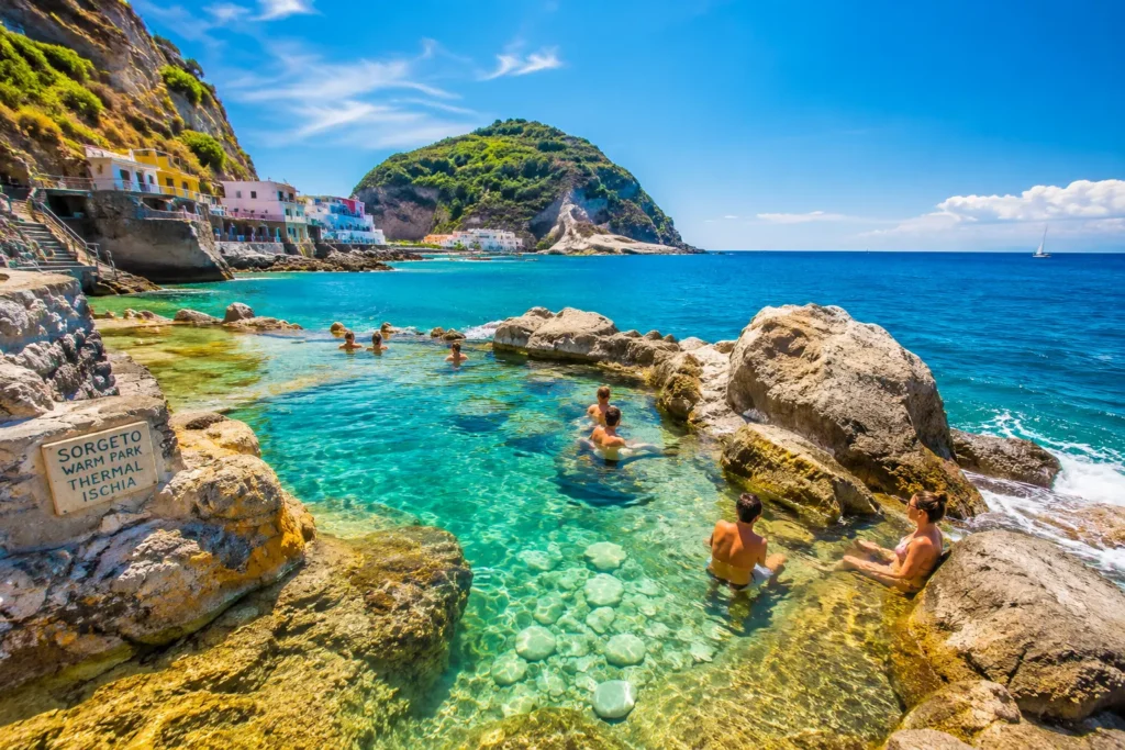 Natural thermal pools in Ischia where warm waters flow into the sea